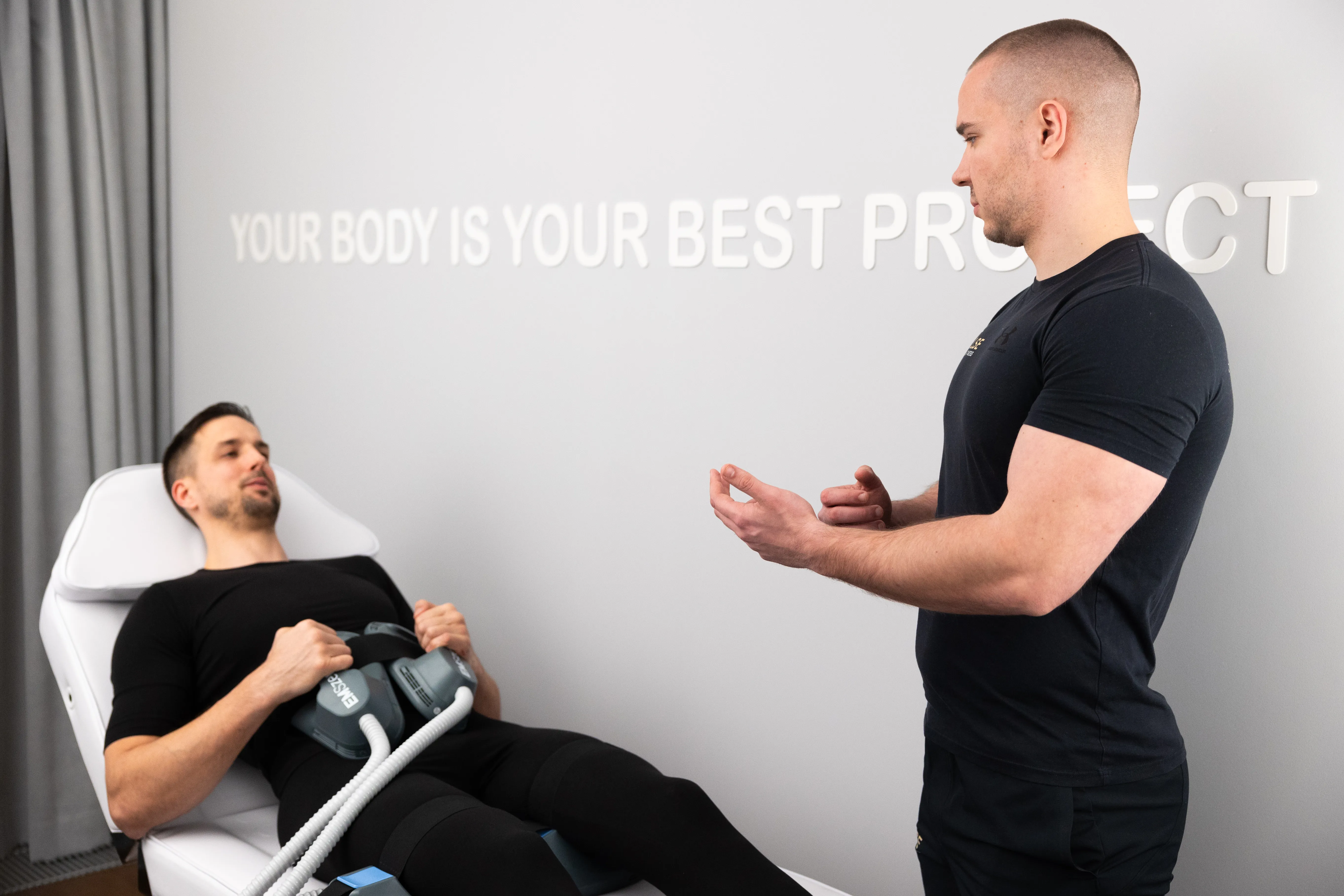 Trainer explaining Tesla Body Sculpt